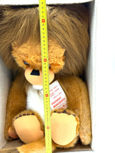 Load image into Gallery viewer, Front view of Betsy Belle plush lion toy in original box with measuring tape.