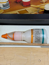 Carica l'immagine nel visualizzatore di Gallery, Detail view of a glue bottle from the Prosolar kit with a transparent design.
