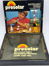 Carica l'immagine nel visualizzatore di Gallery, Open view of the Prosolar model kit box showcasing colorful design and illustrations.