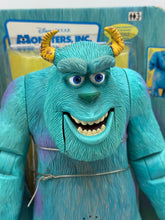 Carica l'immagine nel visualizzatore di Gallery, Close-up detail of the blue monster Sulley's smiling face with horns.