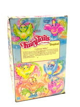 Carica l'immagine nel visualizzatore di Gallery, Packaging detail of Hasbro Fairy Tails box showing vibrant patterns and torn edge.