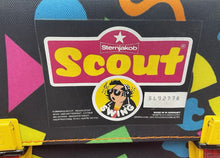 Load image into Gallery viewer, Detail close-up of the Scout backpack label with brand logo and text.