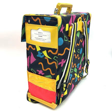 Load image into Gallery viewer, Side view of the colorful Scout backpack displaying vibrant patterns and zipper closure.