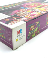 Load image into Gallery viewer, Side view of Frega la Strega game box with colorful design and brand logo.