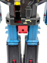 Load image into Gallery viewer, Detail view of the robot figure highlighting mechanical joints and transformable parts.