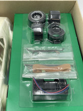 Load image into Gallery viewer, Rear view of vintage Revell BMW M1 Turbo radio-controlled car displaying taillights and exhaust