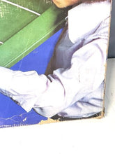 Load image into Gallery viewer, Close-up of the game box side displaying a damaged corner.