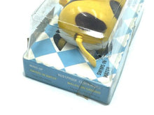 Load image into Gallery viewer, Front view of the yellow Bandai Wind-up Swimming and Walking Dog in transparent packaging.
