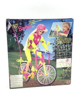 Load image into Gallery viewer, Lifestyle shot of a colorful bicycle with Barbie rider in an outdoor setting.
