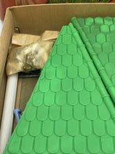 Load image into Gallery viewer, Detail view of Pimea Chalet toy bird house plastic sheets with various textures.