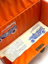 Carica l'immagine nel visualizzatore di Gallery, Inside view of orange carrying bag with printed design and empty interior
