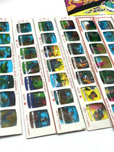 Load image into Gallery viewer, Detail close-up of sticker sheets showcasing various images in blue, yellow, and red.