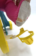 Load image into Gallery viewer, Side view of the Mattel Tippee Toes doll's foot highlighting shoe detail and colorful design.