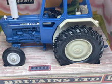 Load image into Gallery viewer, Britains Ford 6600 tractor side view highlighting large tires and side detail in blue and white.