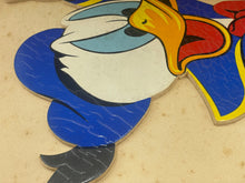 Load image into Gallery viewer, Close-up of a colorful bird design with blue and white colors.