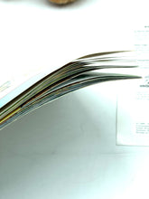 Load image into Gallery viewer, Close-up of storybook pages featuring colorful illustrations and text.