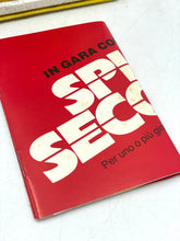 Carica l'immagine nel visualizzatore di Gallery, Detail close-up of a red book with bold text and graphic design.