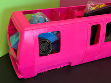 Carica l'immagine nel visualizzatore di Gallery, Side view of the pink toy vehicle with transparent windows.