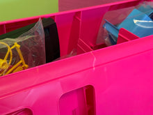 Carica l'immagine nel visualizzatore di Gallery, Various items in a bin, showcasing pink, blue, and yellow colors.