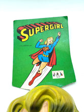 Load image into Gallery viewer, Detail close-up of the Supergirl mask with red eyes and a party hat