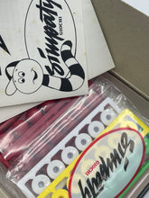 Load image into Gallery viewer, Detail close-up of Simpaty Arancia Meccanica game components featuring cards and logo.