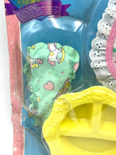 Load image into Gallery viewer, Detail shot of various toy accessories in blue, pink, and yellow with colorful patterns.