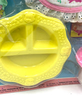Load image into Gallery viewer, Close-up of a yellow plastic mold with circular shape and divided sections.