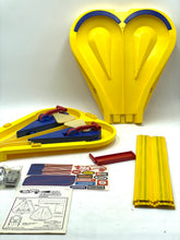 Carica l'immagine nel visualizzatore di Gallery, Other view of yellow sled components including two sled halves and various accessories.