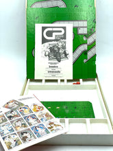 Load image into Gallery viewer, Detail view of the open GRAND PRIX board game box showing the game board and instruction sheet.