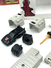 Load image into Gallery viewer, Transformers G1 Metroplex black car accessory with various parts on a white background.