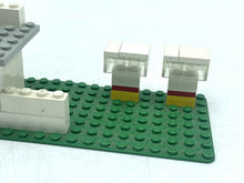 Carica l'immagine nel visualizzatore di Gallery, Back view of LEGO Shell gas station with a flat roof and green base.