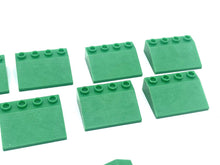 Load image into Gallery viewer, LEGO green building blocks close-up detail showcasing flat pieces and interlocking design.