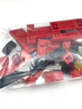 Carica l'immagine nel visualizzatore di Gallery, Close-up of LEGO instruction manual on table featuring car model illustration.