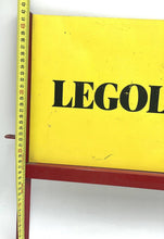 Carica l'immagine nel visualizzatore di Gallery, Detail shot of the yellow LEGOLAND sign with bordered text against a white background.