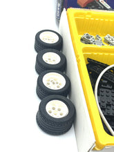 Carica l'immagine nel visualizzatore di Gallery, Detail view of four LEGO tires with white rims on a white background.