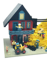 Carica l'immagine nel visualizzatore di Gallery, LEGO motorized mine set side view highlighting barn structure and colorful mini figures.