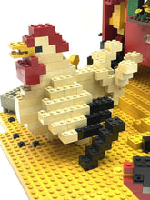 Carica l'immagine nel visualizzatore di Gallery, Close-up of a white chicken figure in a sitting pose.