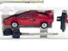 Load image into Gallery viewer, Takara Transformers G1 Sideswipe packaging view showcasing detailed design of red toy car.