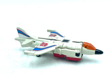 Load image into Gallery viewer, Side view of Takara GiG Transformers G1 Slingshot with folded wings and colorful accents.