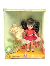 Load image into Gallery viewer, Migliorati Bambola Vania doll in box with floral design and pigtails, packaging view.