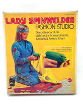 Load image into Gallery viewer, Mattel 1974 Lady Spinwelder Fashion Studio Kit packaging view with colorful design and instructions.