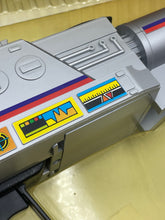 Load image into Gallery viewer, Detail view of a silver and yellow printer cartridge with design graphics and color labels.