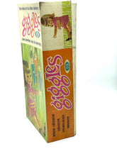 Load image into Gallery viewer, Detail close-up of the corner of the Ideal Toy Giggles doll packaging.