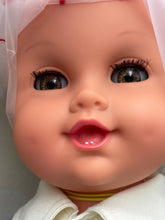 Load image into Gallery viewer, Close-up of Sebino Doll clothing featuring button details and striped sleeves.