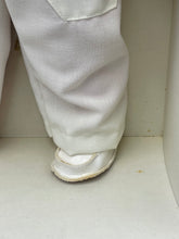 Load image into Gallery viewer, Detail of Sebino Doll's foot showcasing sneaker style with shiny surface.