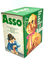 Load image into Gallery viewer, Close-up detail of Sebino Asso dog toy with instruction card in packaging.