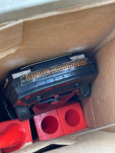 Load image into Gallery viewer, Black device with red blocks, showcasing the mechanism of the Mattel Drive Command Mustang Turbo.