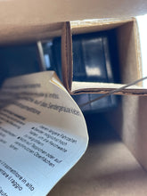 Load image into Gallery viewer, Detail view of the paper inside the box for the Mattel Drive Command Mustang Turbo.