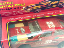 Load image into Gallery viewer, Detail view of the Audi Quattro Rallye toy car showcasing colorful decals and number 32.