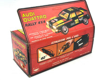 Load image into Gallery viewer, Vintage design packaging of the Audi Quattro Rallye toy car kit with illustrated box and included instructions.